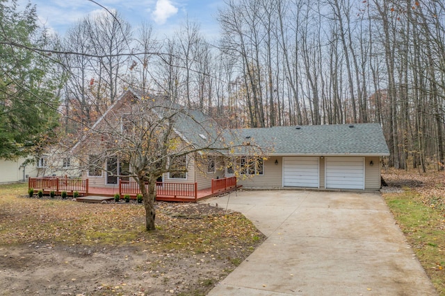 view of front of property with a garage and a wooden deck