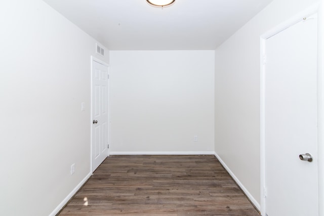 spare room featuring dark hardwood / wood-style flooring