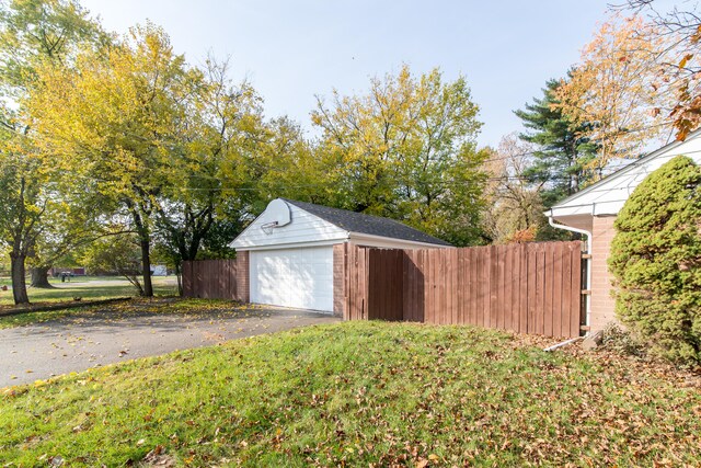 garage featuring a yard