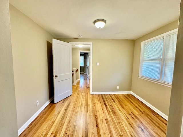 spare room featuring light hardwood / wood-style flooring