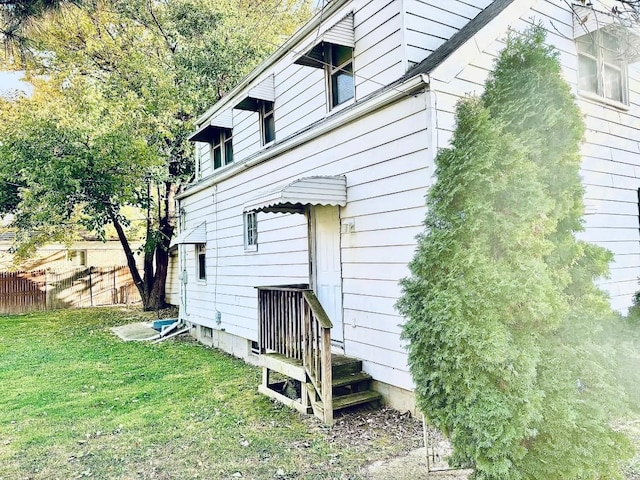 view of home's exterior featuring a yard