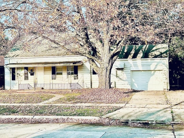 view of front of house featuring covered porch and a garage