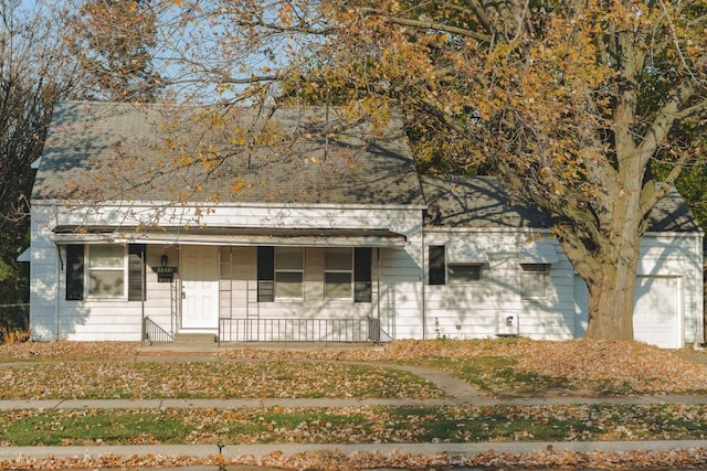 view of front of house featuring a porch and a garage