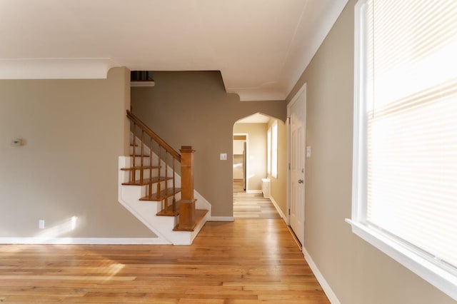 hallway with light hardwood / wood-style floors