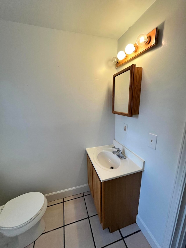 bathroom with tile patterned floors, vanity, and toilet