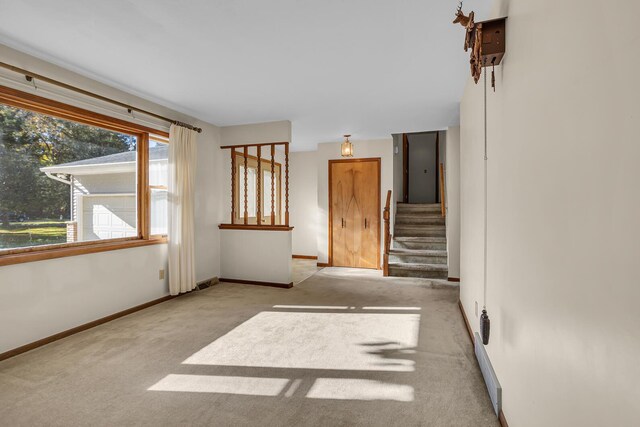 190 Steves Scenic Dr, Horton, MI 49246 - carpeted empty room with baseboards and stairs