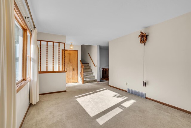 190 Steves Scenic Dr, Horton, MI 49246 - empty room featuring stairs, carpet flooring, and baseboards