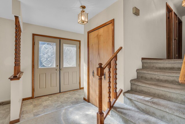 190 Steves Scenic Dr, Horton, MI 49246 - foyer entrance featuring baseboards and stairs