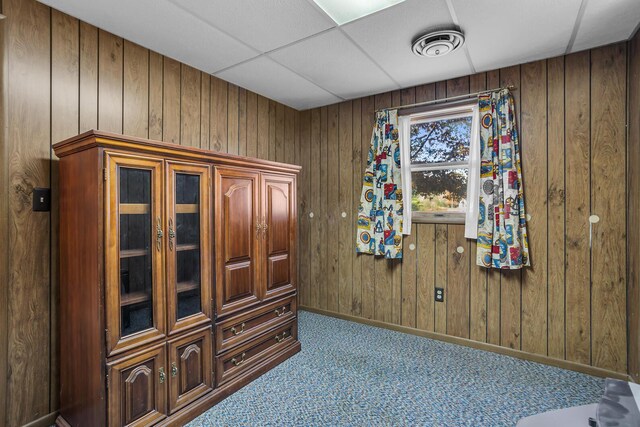190 Steves Scenic Dr, Horton, MI 49246 - carpeted bedroom featuring wooden walls and baseboards