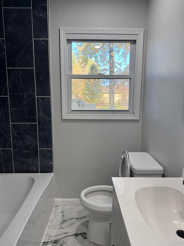 full bathroom with vanity, toilet, and tiled shower / bath