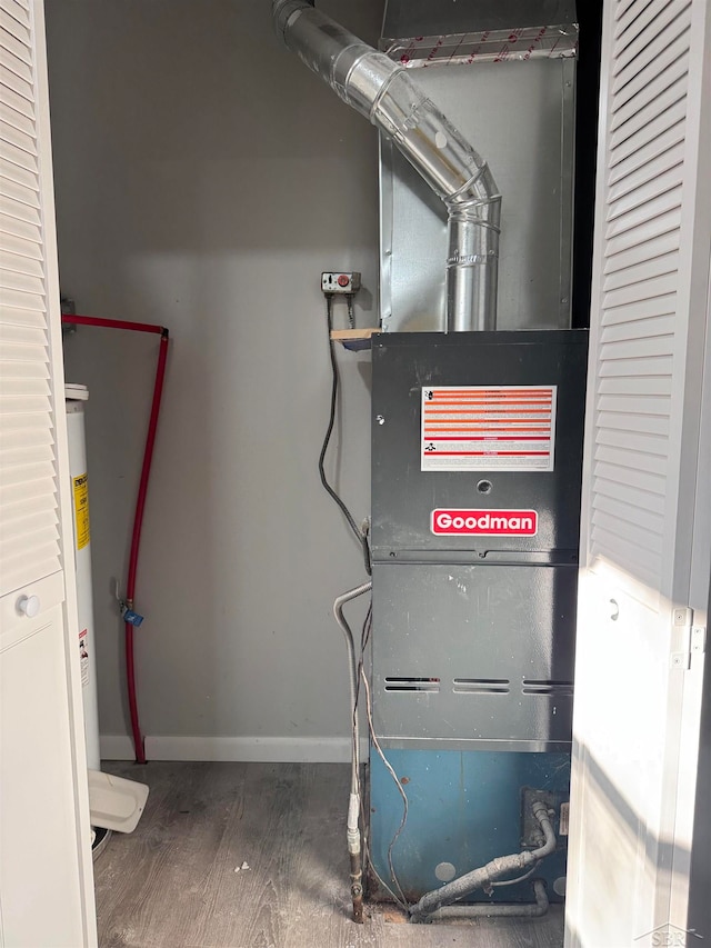 utility room with heating unit