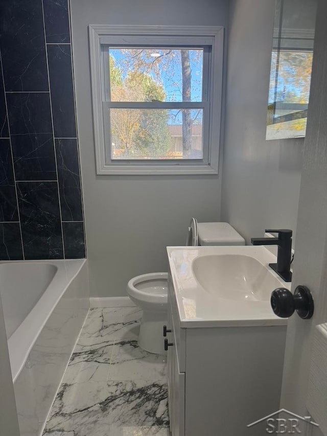 full bathroom featuring vanity, tiled shower / bath combo, and toilet