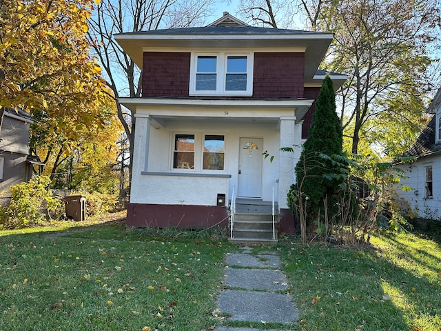 54 Nelson St, Pontiac, MI 48342 - view of front of property featuring a front yard and stucco siding