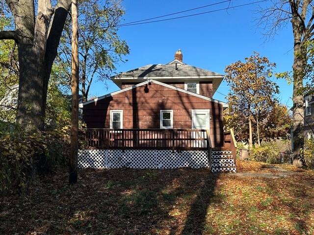 54 Nelson St, Pontiac, MI 48342 - rear view of property with a deck and a chimney