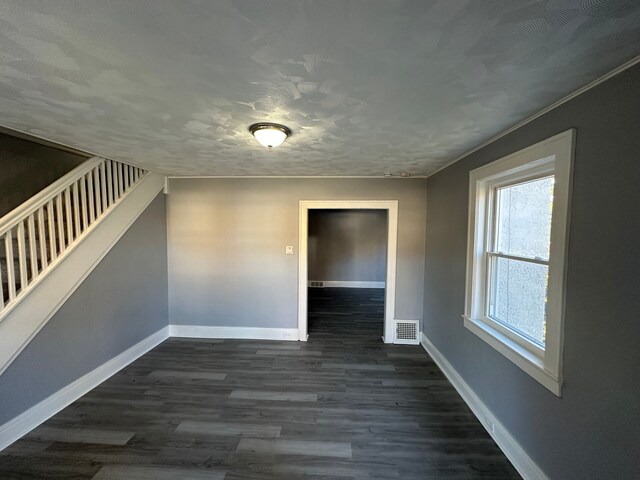 54 Nelson St, Pontiac, MI 48342 - empty room featuring baseboards, stairway, and dark wood-style flooring