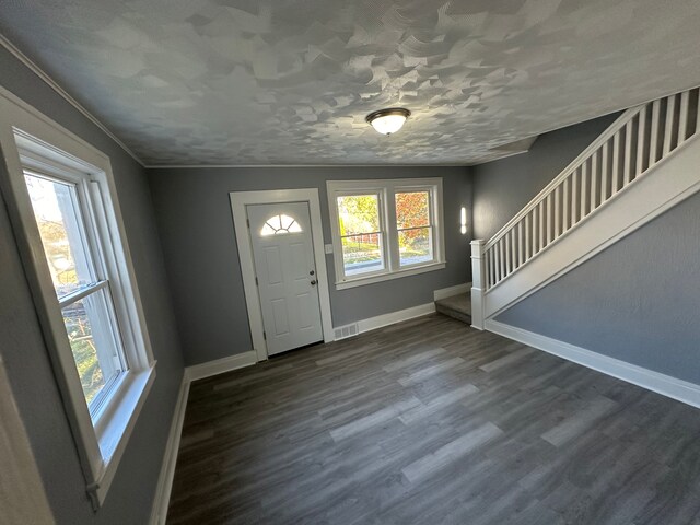54 Nelson St, Pontiac, MI 48342 - entrance foyer with healthy amount of natural light, baseboards, stairway, dark wood-style flooring, and ornamental molding