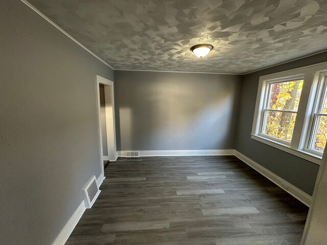 54 Nelson St, Pontiac, MI 48342 - unfurnished room with dark wood-type flooring and baseboards