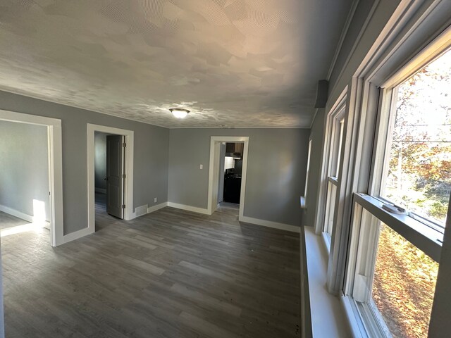 54 Nelson St, Pontiac, MI 48342 - unfurnished room featuring baseboards and dark wood-style floors