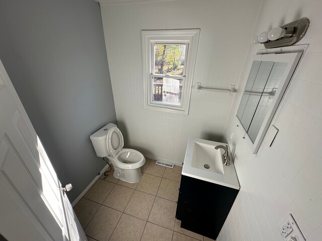 54 Nelson St, Pontiac, MI 48342 - bathroom featuring toilet, tile patterned flooring, vanity, and baseboards