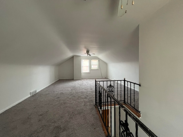 bonus room with carpet floors, vaulted ceiling, and ceiling fan