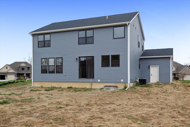 rear view of property featuring cooling unit