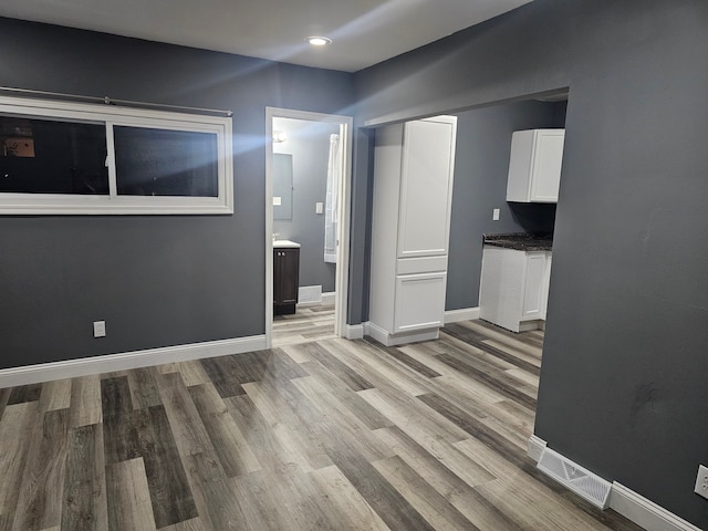 unfurnished living room featuring light wood-type flooring