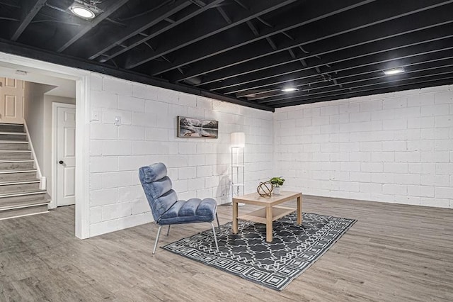 sitting room with wood-type flooring