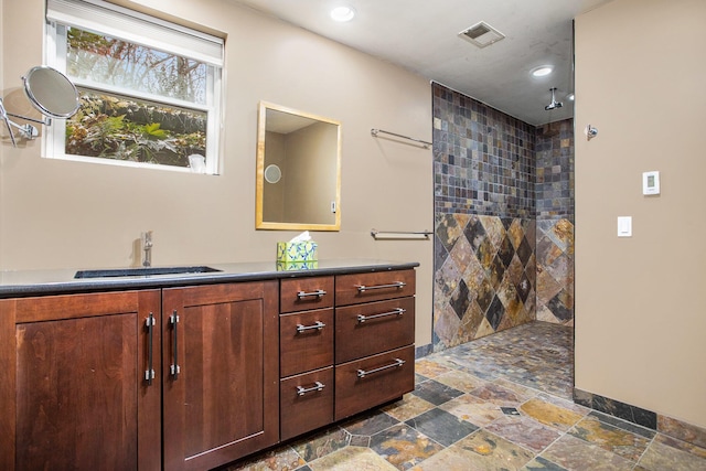 16460 15 Mile Rd, Marshall, MI 49068 - full bathroom featuring stone tile floors, vanity, walk in shower, and recessed lighting