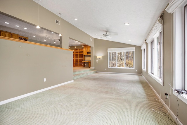 16460 15 Mile Rd, Marshall, MI 49068 - unfurnished living room featuring light colored carpet, a ceiling fan, vaulted ceiling, and recessed lighting