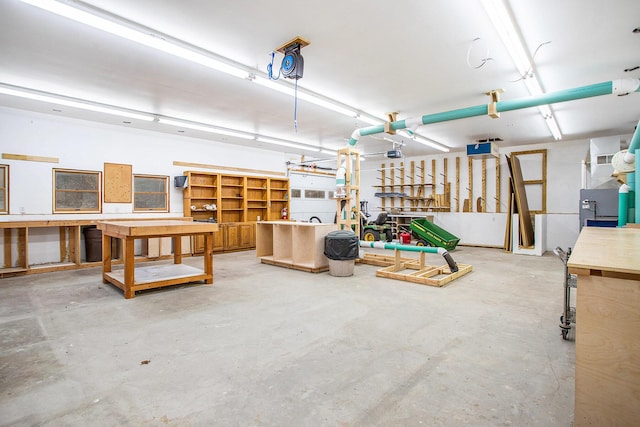 16460 15 Mile Rd, Marshall, MI 49068 - garage with a workshop area and a garage door opener