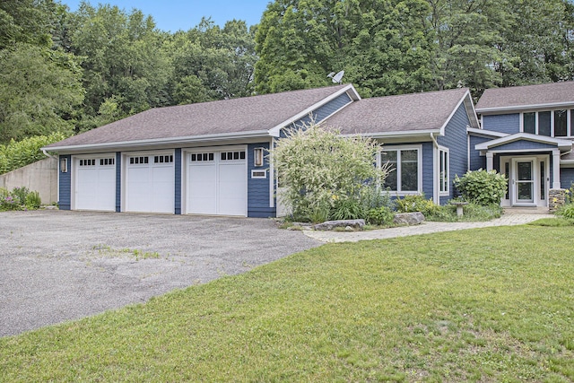 16460 15 Mile Rd, Marshall, MI 49068 - view of front of home featuring a front lawn, a garage, and a shingled roof