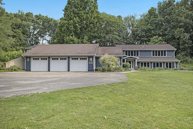 16460 15 Mile Rd, Marshall, MI 49068 - view of front facade featuring a garage, driveway, a front lawn, and a shingled roof