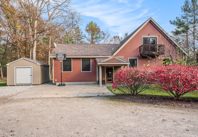 view of front of property featuring a storage unit