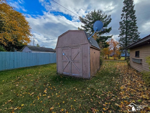 view of outbuilding with a lawn