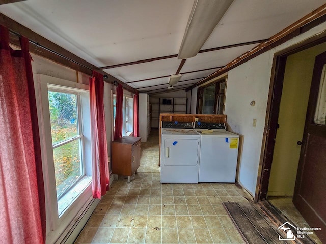 clothes washing area featuring washer and dryer and a baseboard heating unit