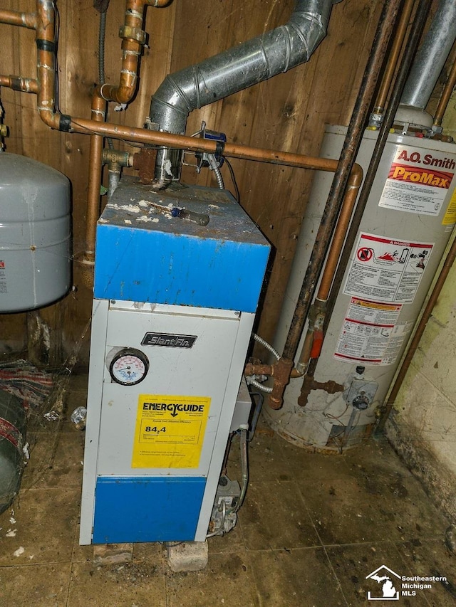 utility room featuring water heater