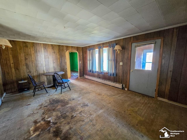 entrance foyer with wooden walls and a baseboard radiator