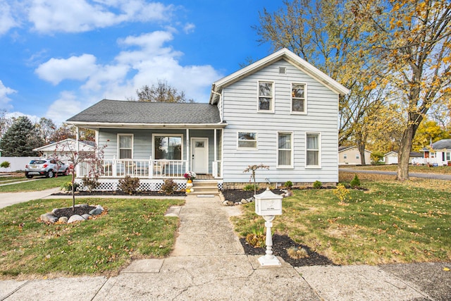 view of front of property with a porch and a front lawn