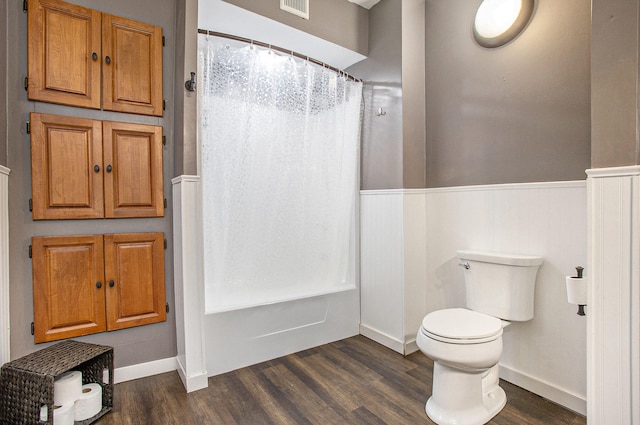 bathroom featuring wood-type flooring and toilet