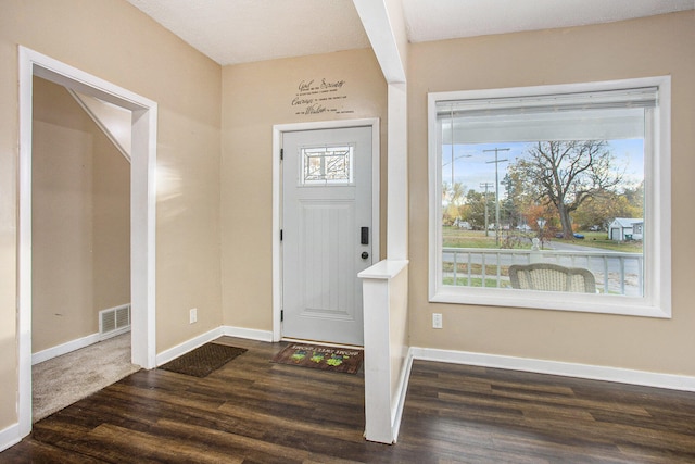 foyer with dark hardwood / wood-style floors