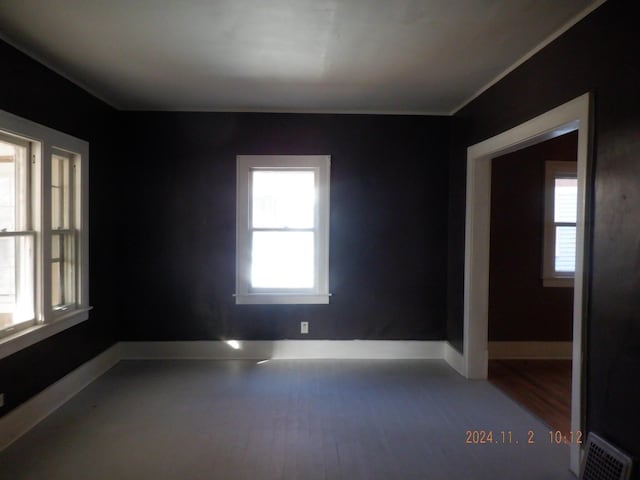 124 W Maple St, Kalamazoo, MI 49001 - empty room with wood finished floors and baseboards