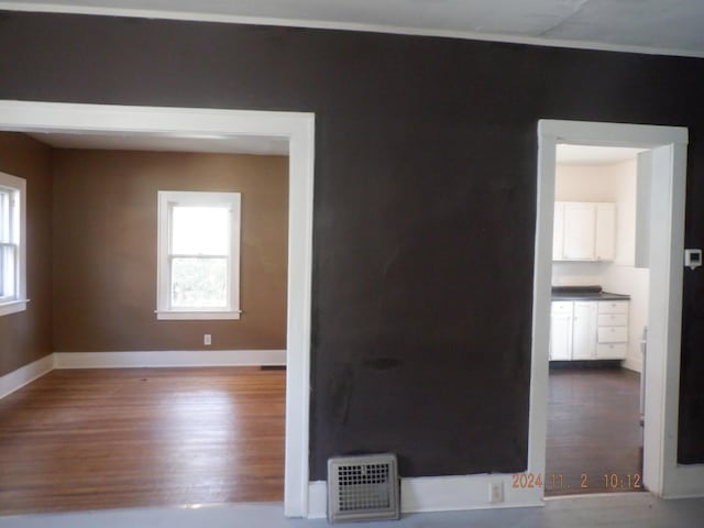 124 W Maple St, Kalamazoo, MI 49001 - spare room featuring wood finished floors