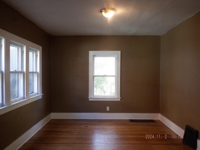 124 W Maple St, Kalamazoo, MI 49001 - unfurnished room featuring dark wood-type flooring and baseboards