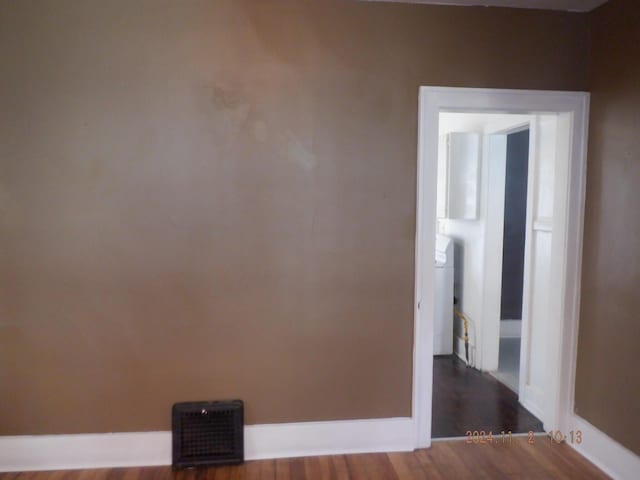 124 W Maple St, Kalamazoo, MI 49001 - unfurnished room featuring dark wood-style floors and baseboards