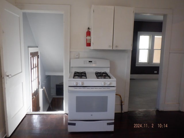124 W Maple St, Kalamazoo, MI 49001 - kitchen with white gas stove, white cabinets, and dark wood finished floors