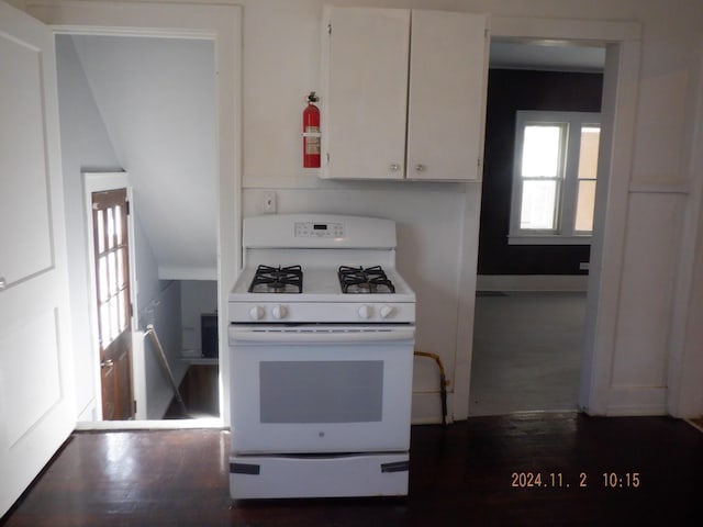 124 W Maple St, Kalamazoo, MI 49001 - kitchen featuring white gas range oven, white cabinets, and dark wood-type flooring