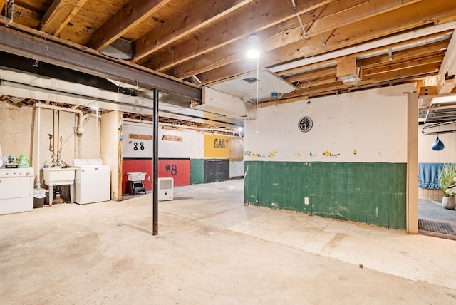 basement featuring washer / clothes dryer and sink