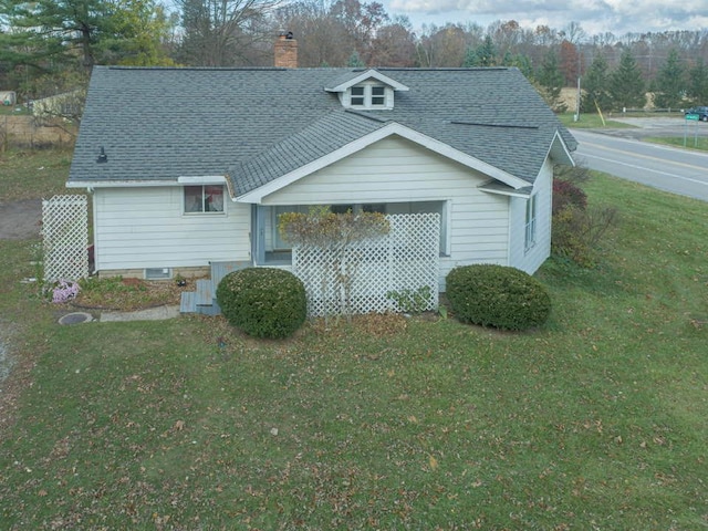 view of home's exterior featuring a lawn