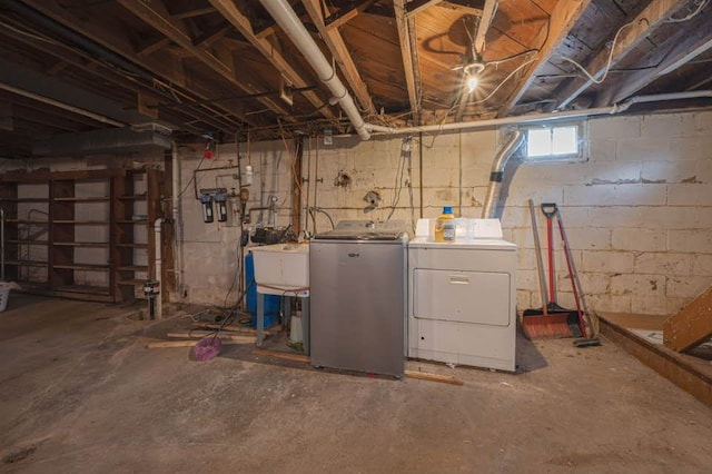 basement with washer and dryer and sink