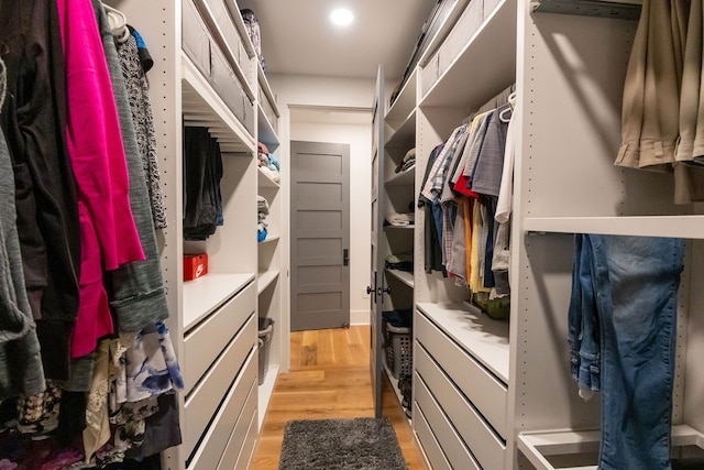 spacious closet featuring light hardwood / wood-style floors